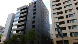A multi-story hotel building with a prominent sign reading "HOTEL LIVEMAX." - Hotel LiVEMAX Kayabacho (Tokyo)