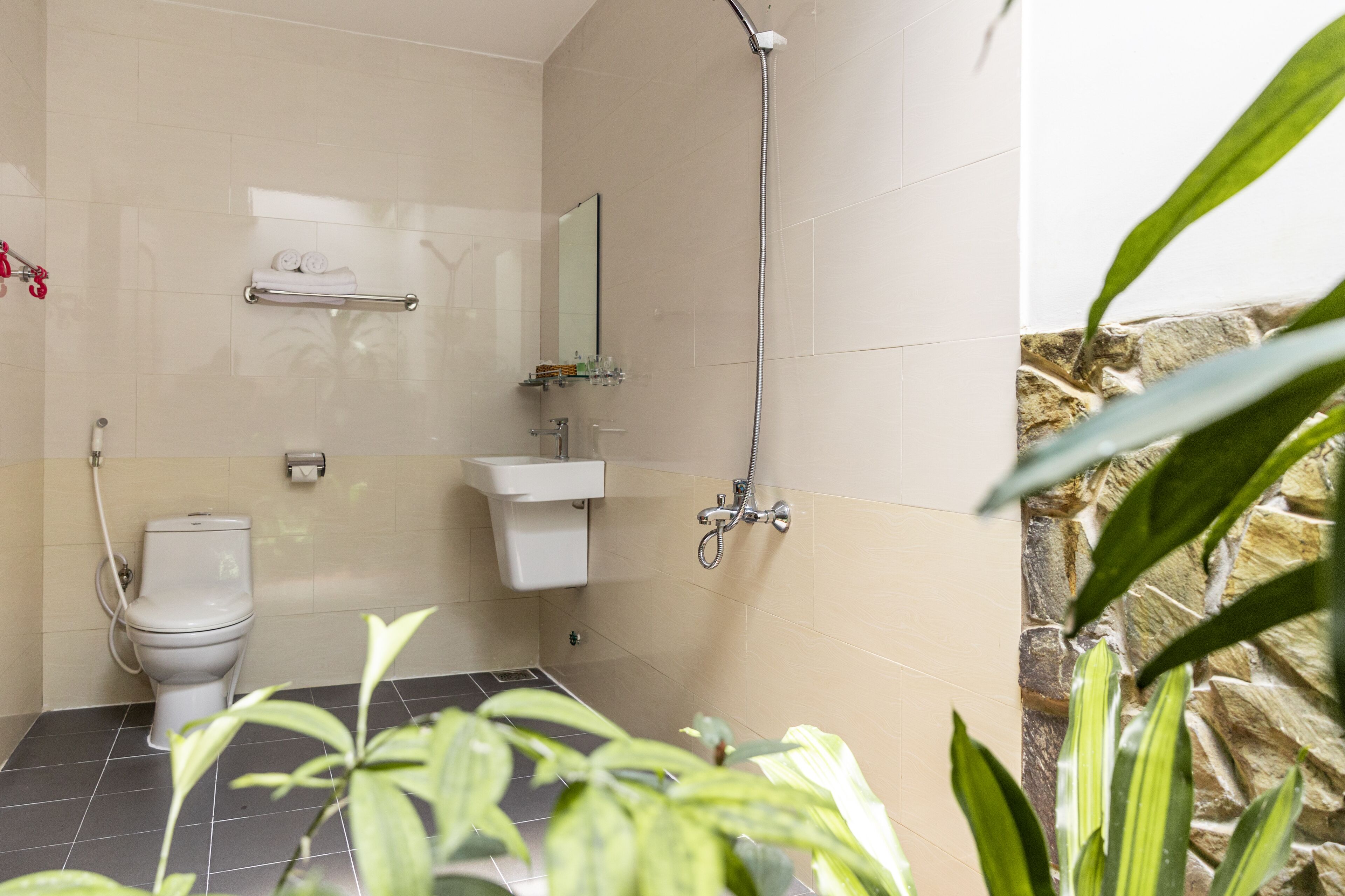 deluxe room, pool view | bathroom | shower, free toiletries, hair dryer, slippers
