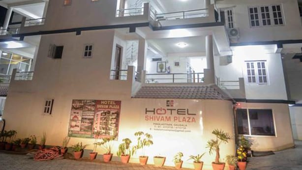 A multi-story hotel with balconies and a sign indicating it is located at Shivam Plaza. - Hotel Shivam Plaza (Kathmandu)