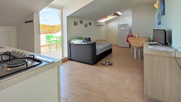 Panoramic Loft, 1 Bedroom, Terrace, Sea View | Living area | LCD TV