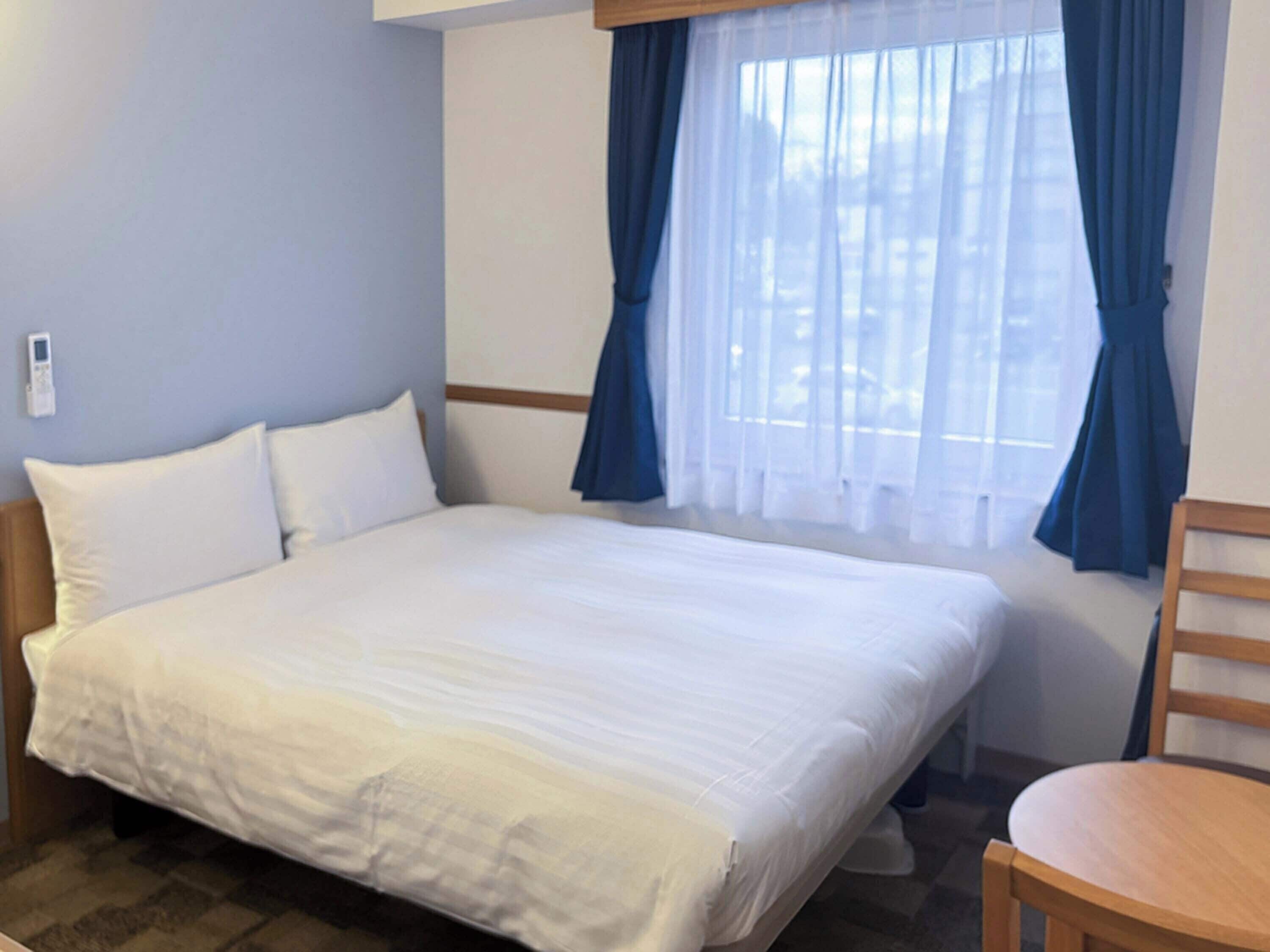 Desk, laptop workspace, free WiFi, bed sheets