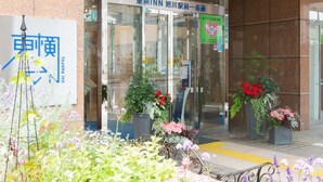 The entrance of Toyoko Inn with a signboard, glass doors, and potted plants. - Toyoko Inn Hokkaido Asahikawa Ekimae Ichijo Dori (Asahikawa)