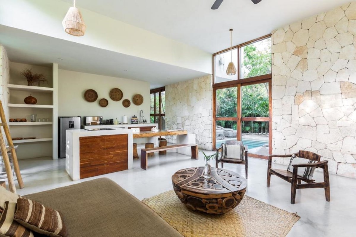 one of the houses in Una Vida, spacious living room and kitchen and a private pool outside