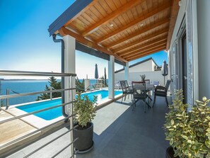 A heated pool, pool loungers