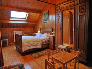 A wooden room with a bed, a desk, a chair, a wardrobe, and a skylight. - House in Ardennes near Lake Nisramont (Bertogne)