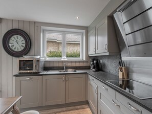 Microwave, stovetop, dishwasher, coffee/tea maker