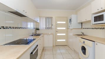 2 Bedroom Apartment | Private kitchen | Fridge, microwave, oven, stovetop