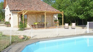 A house with a tiled roof, a covered patio, and a swimming pool. - Pretty Villa With Private Pool in Montadet France (Montadet)