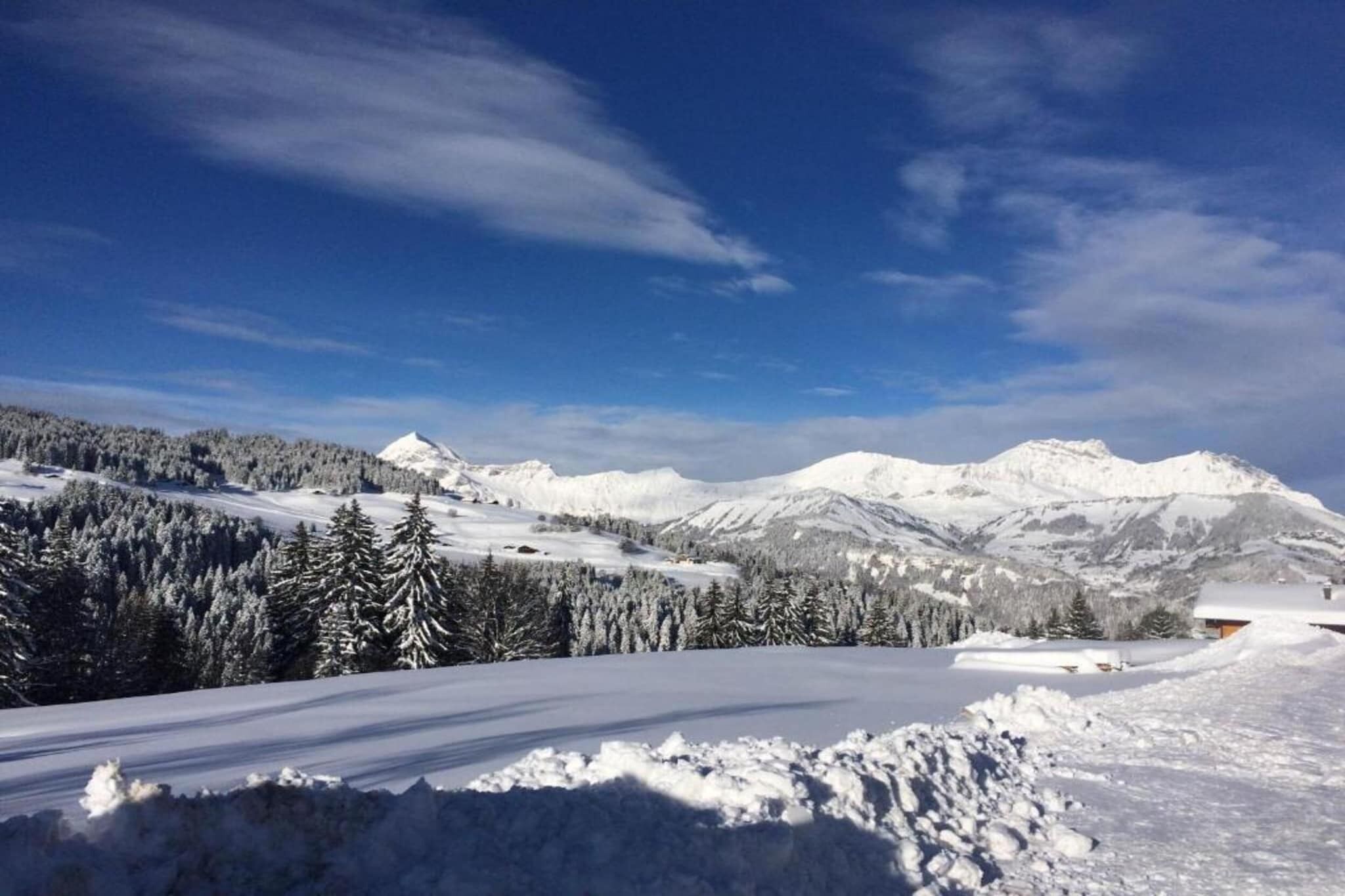 A snowy mountain landscape with a clear sky.