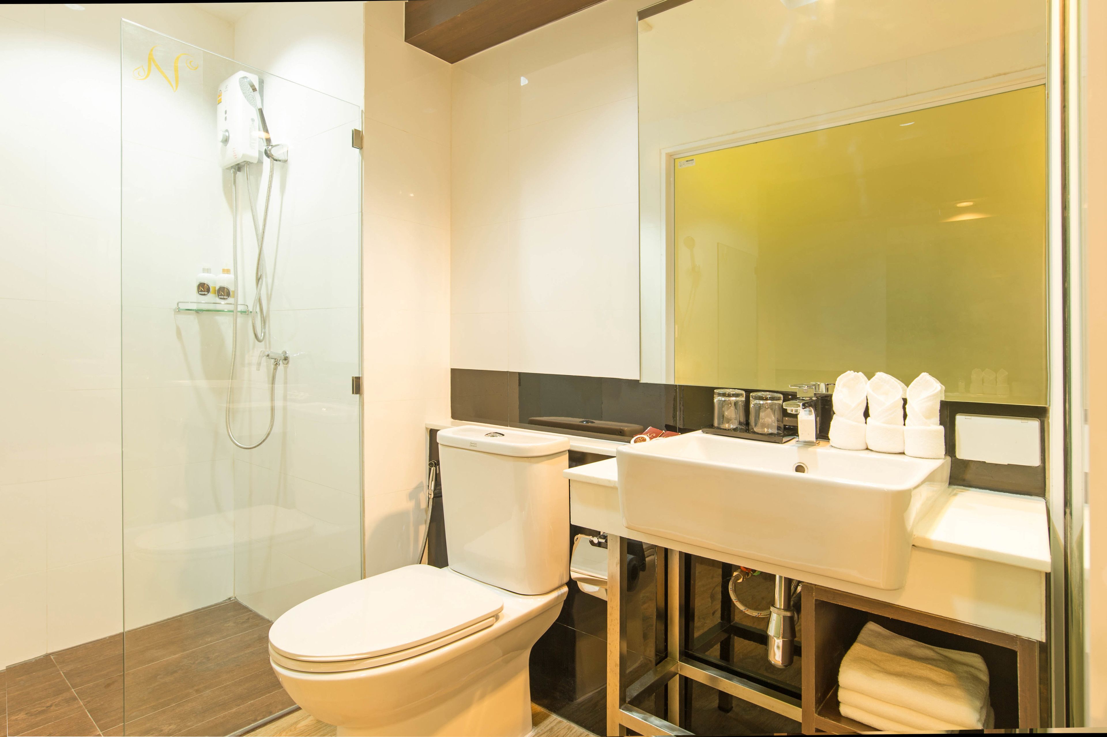 deluxe triple room | bathroom | shower, free toiletries, hair dryer, slippers
