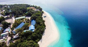 On the beach, sun-loungers, beach umbrellas, beach towels