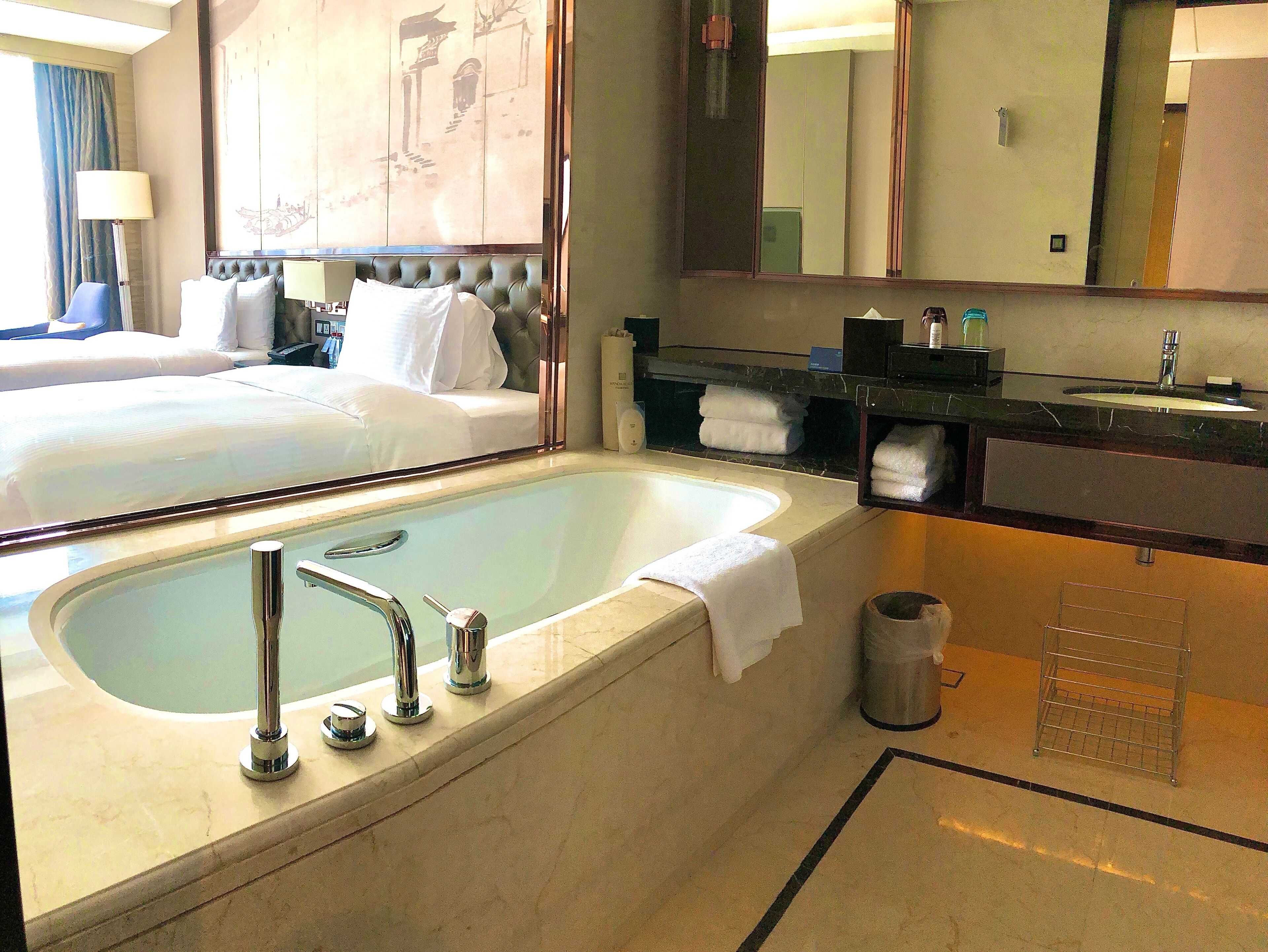 executive twin room | bathroom | separate bathtub and shower, free toiletries, hair dryer, bathrobes