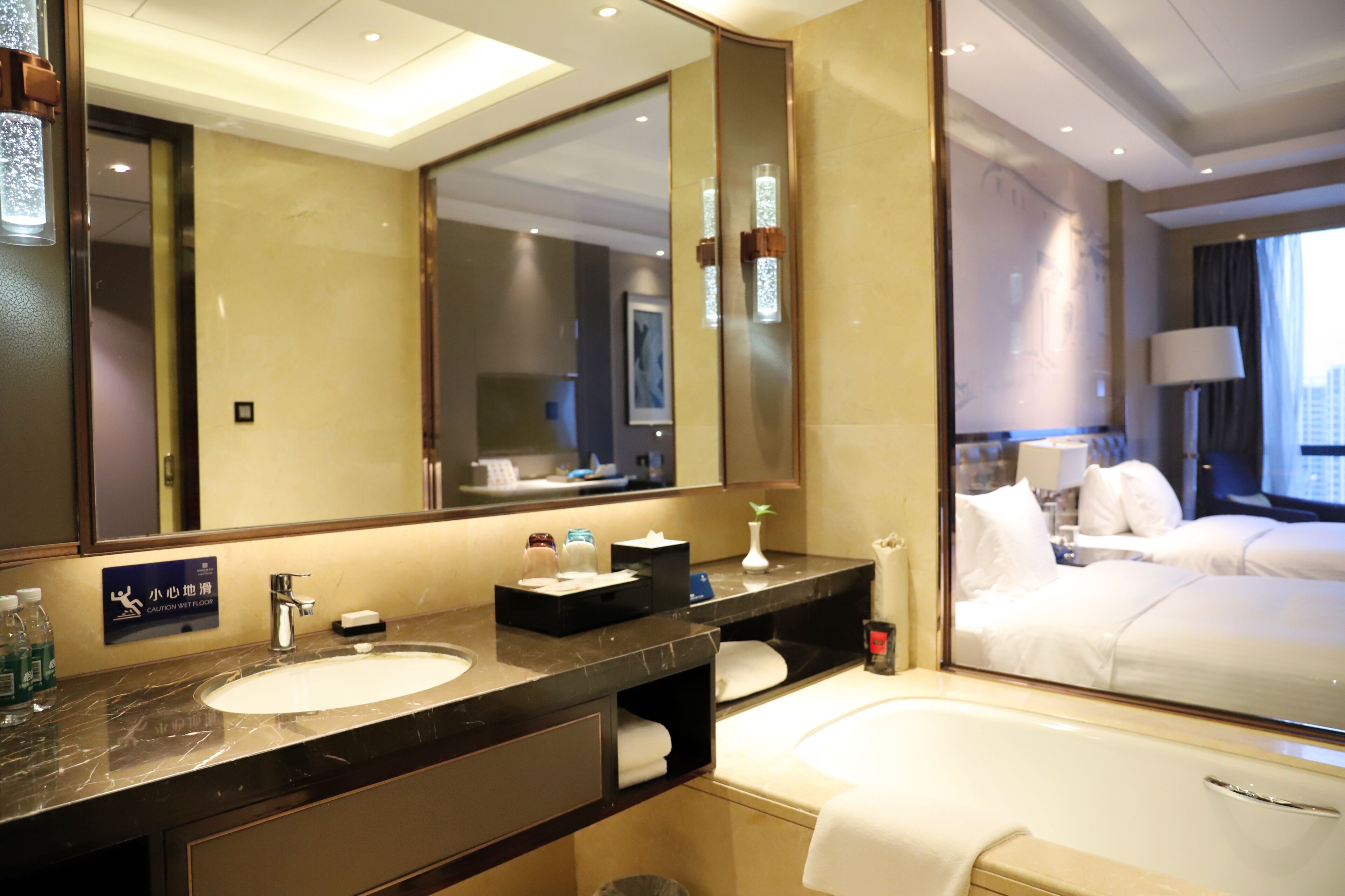 deluxe twin room | bathroom | separate bathtub and shower, free toiletries, hair dryer, bathrobes