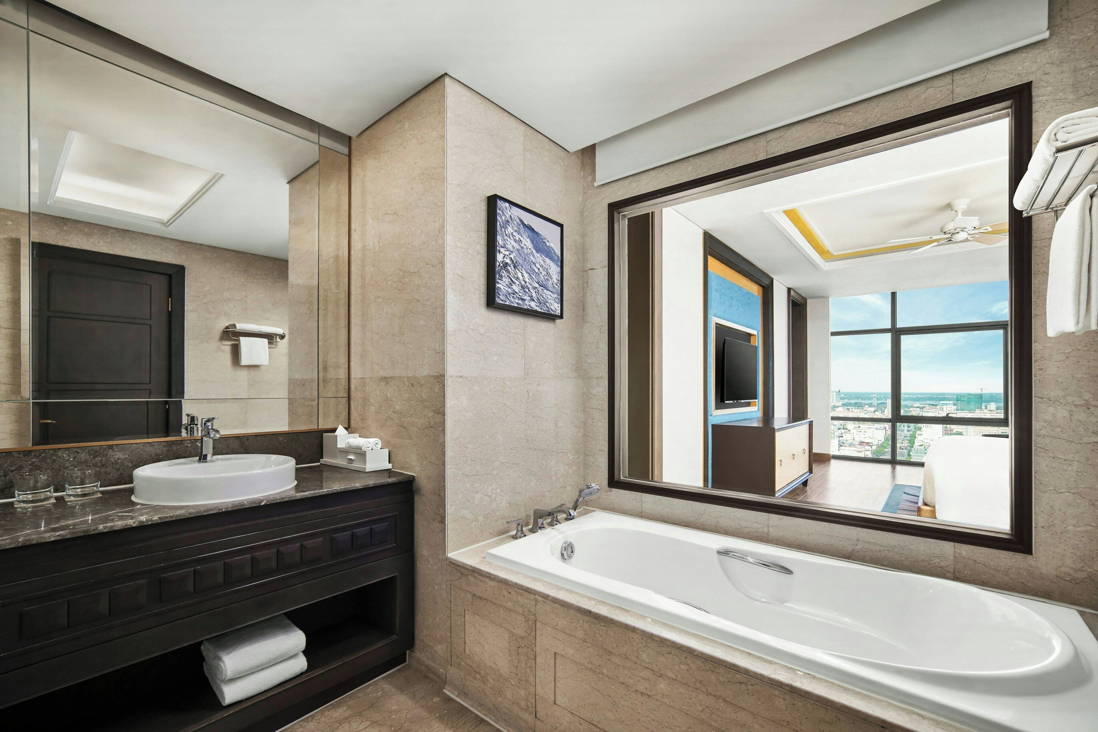 separate bathtub and shower, designer toiletries, hair dryer, bathrobes