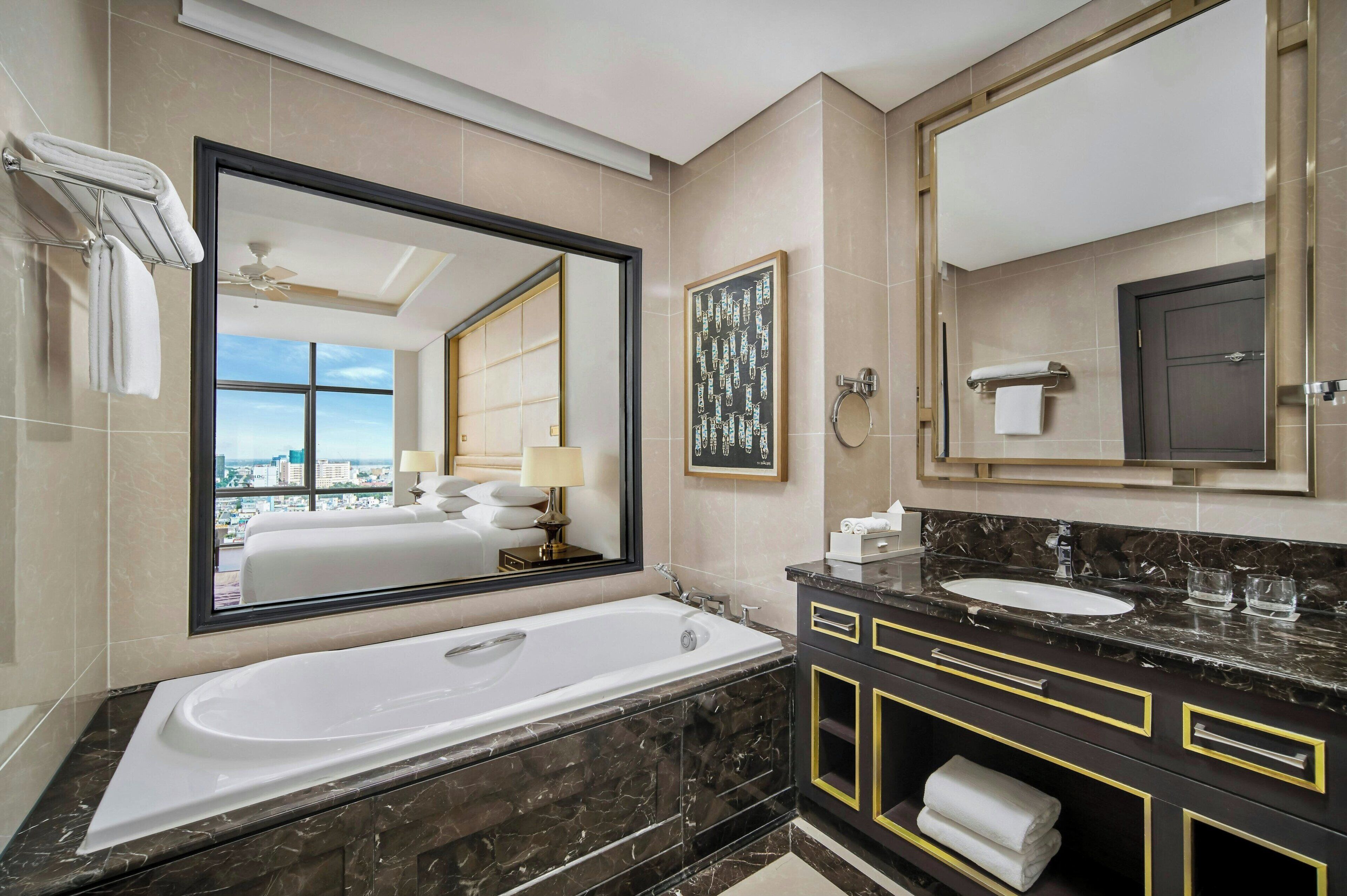 separate bathtub and shower, designer toiletries, hair dryer, bathrobes