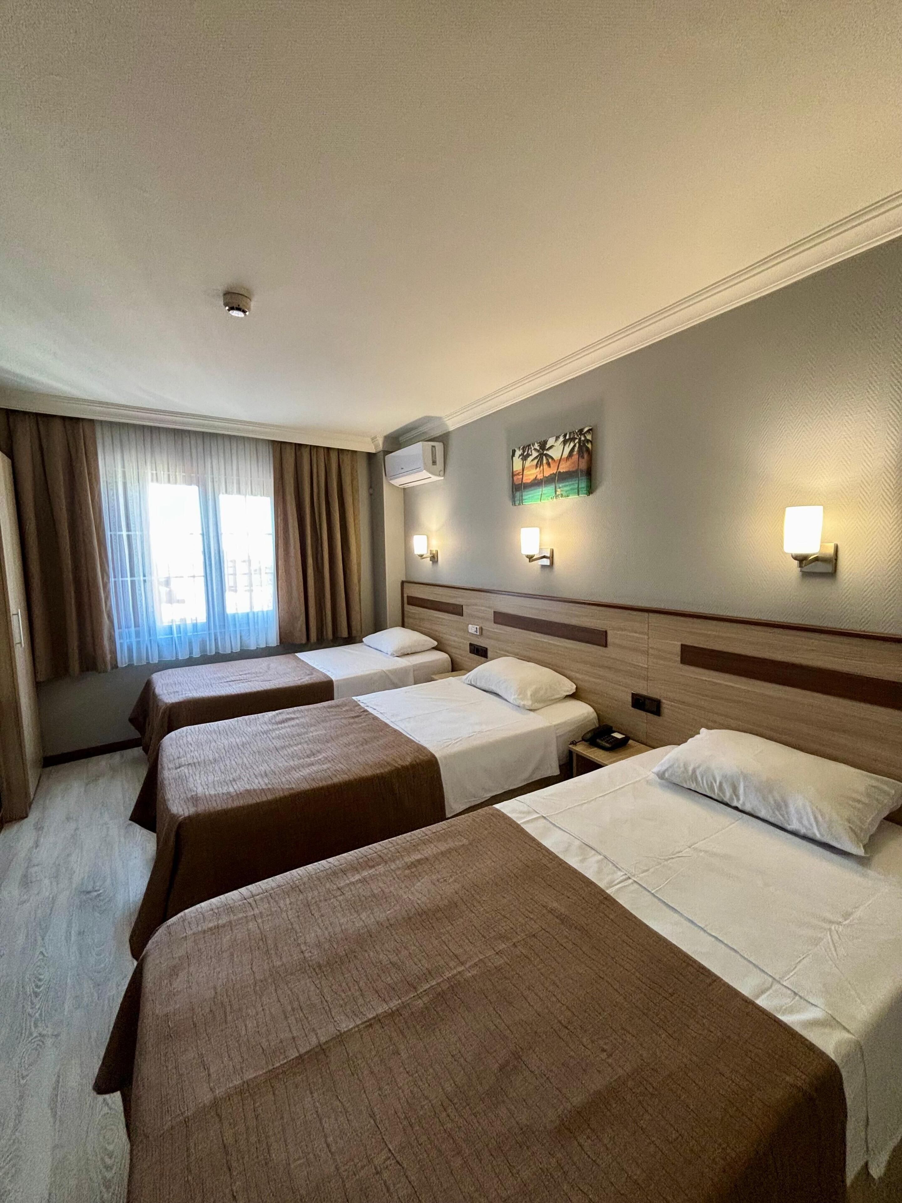Standard Triple Room | In-room safe, desk, free WiFi