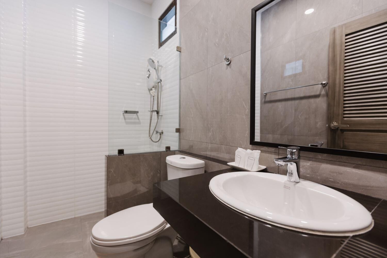 Shower, free toiletries, hair dryer, slippers