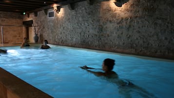 Indoor pool, open 9:00 AM to 7:00 PM, pool loungers