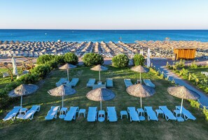 Private beach, free beach shuttle, sun loungers, beach umbrellas