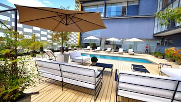 Seasonal outdoor pool, pool umbrellas, pool loungers