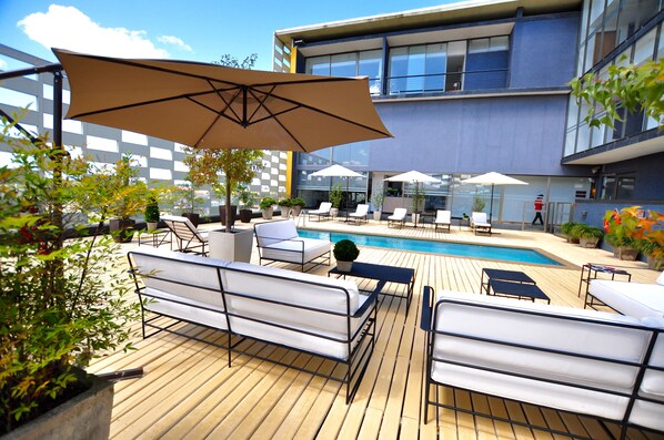 Seasonal outdoor pool, pool umbrellas, pool loungers