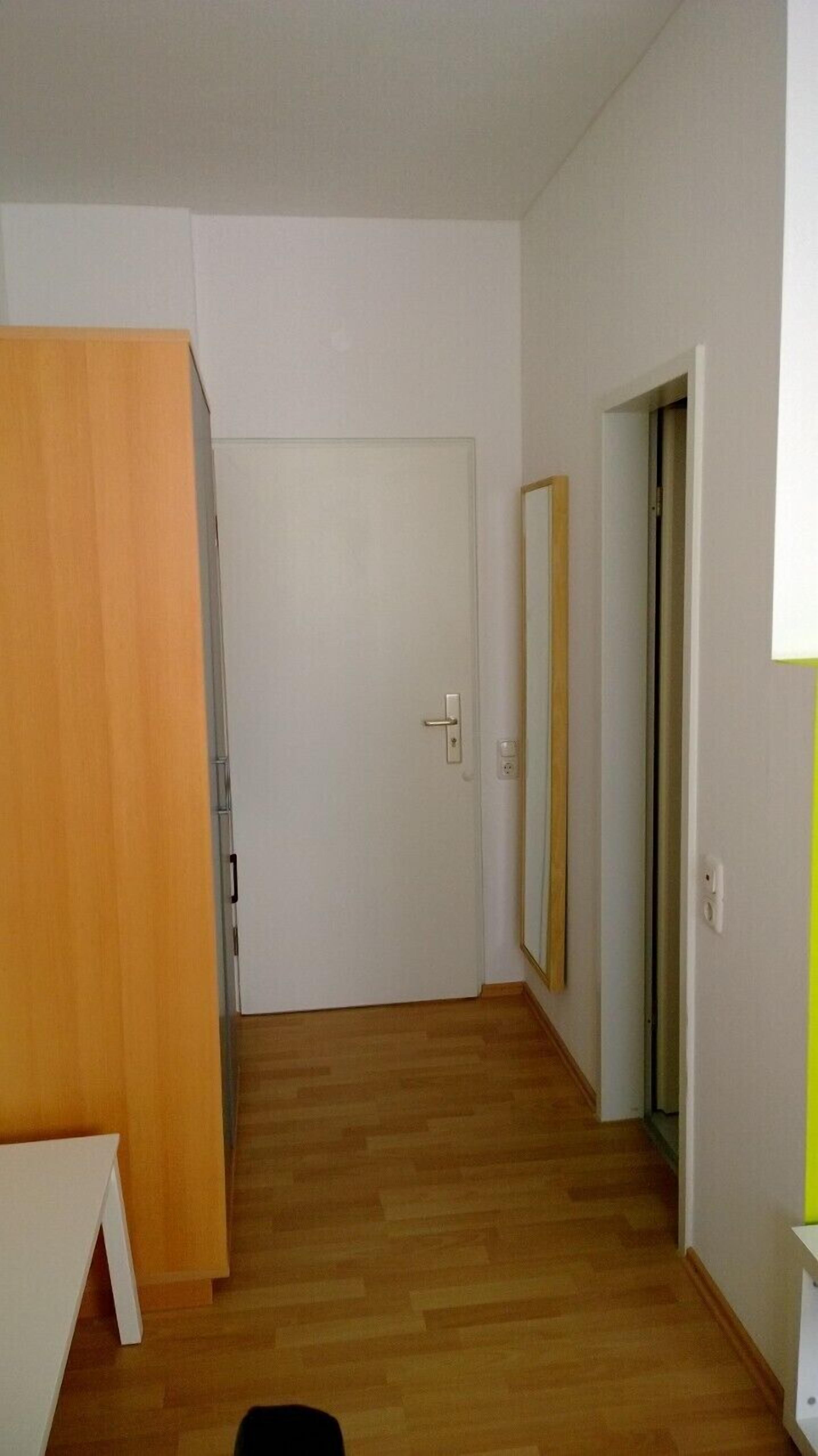 comfort single room | living area | flat-screen tv