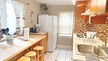 Cottage, 5 Bedrooms | Private kitchen | Fridge, microwave, stovetop, coffee/tea maker