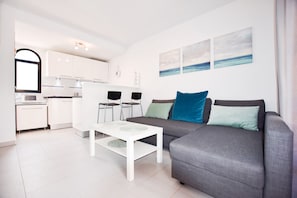 Deluxe-Apartment | Wohnbereich | Flachbildfernseher