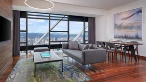A modern living room with a sofa, coffee table, and dining area. - Element by Marriott Kuala Lumpur (Kuala Lumpur)