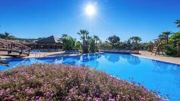 Seasonal outdoor pool, pool loungers, lifeguards on site