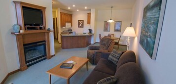 Condo, 1 Bedroom | Living area | Flat-screen TV, fireplace, pay movies