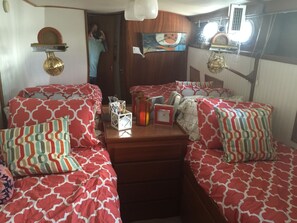 Docked 50' Hatteras, 3 Bedrooms, Bay View | 1 bedroom, desk, iron/ironing board - Classic Yacht Rentals at FloraBama (Orange Beach)