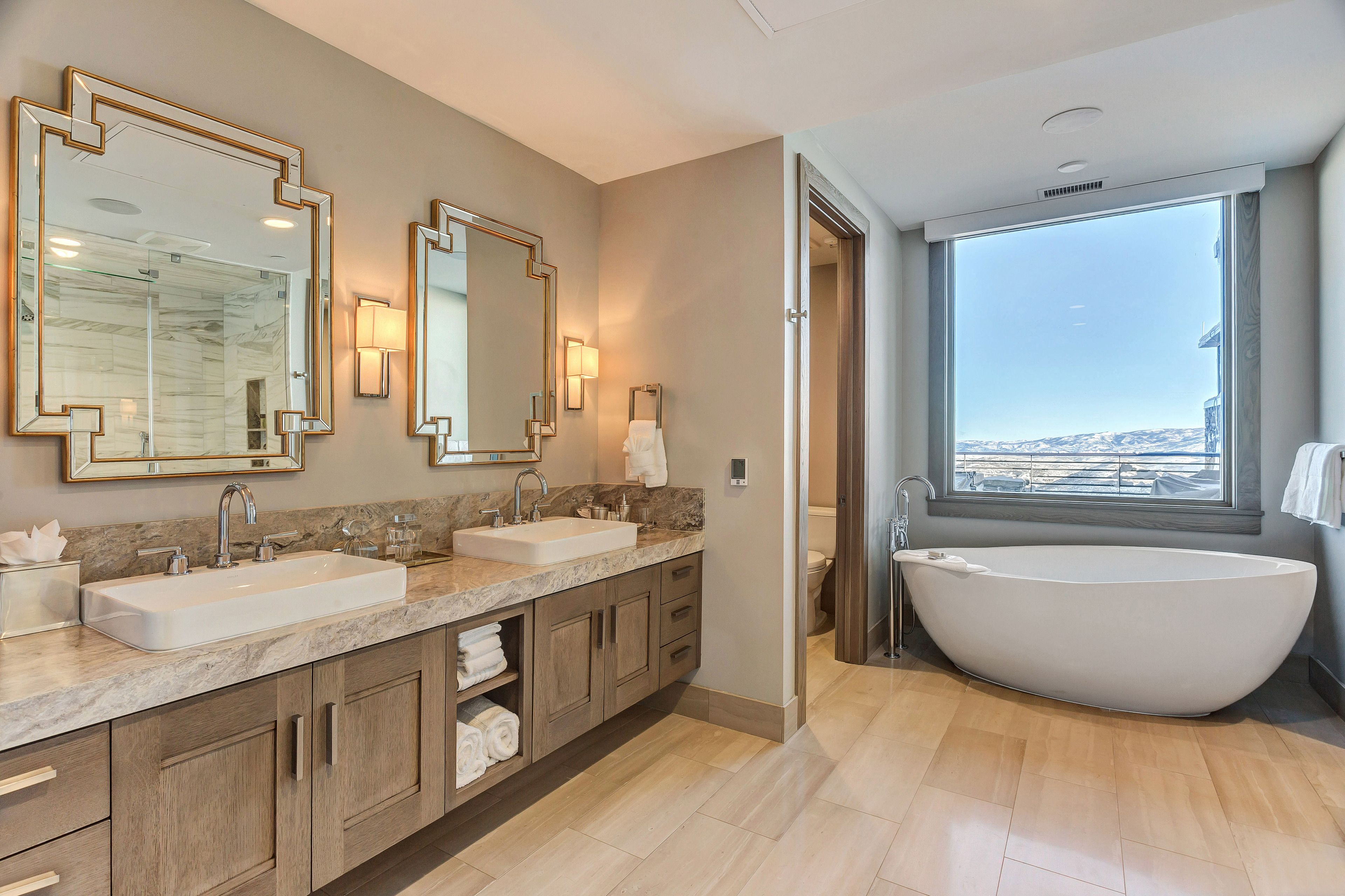 designer toiletries, hair dryer, bathrobes, slippers