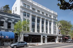 Classic architecture with a symmetrical facade and tall windows.