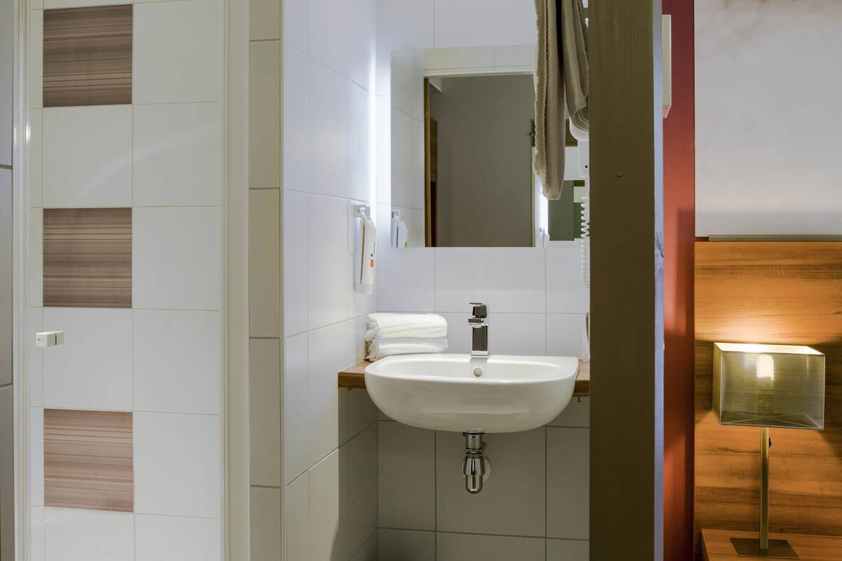 premium bedding, pillow-top beds, desk, blackout curtains