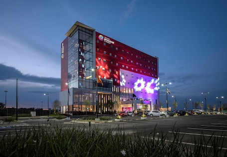 Front of property – evening/night. Ramada Encore by Wyndham Puebla