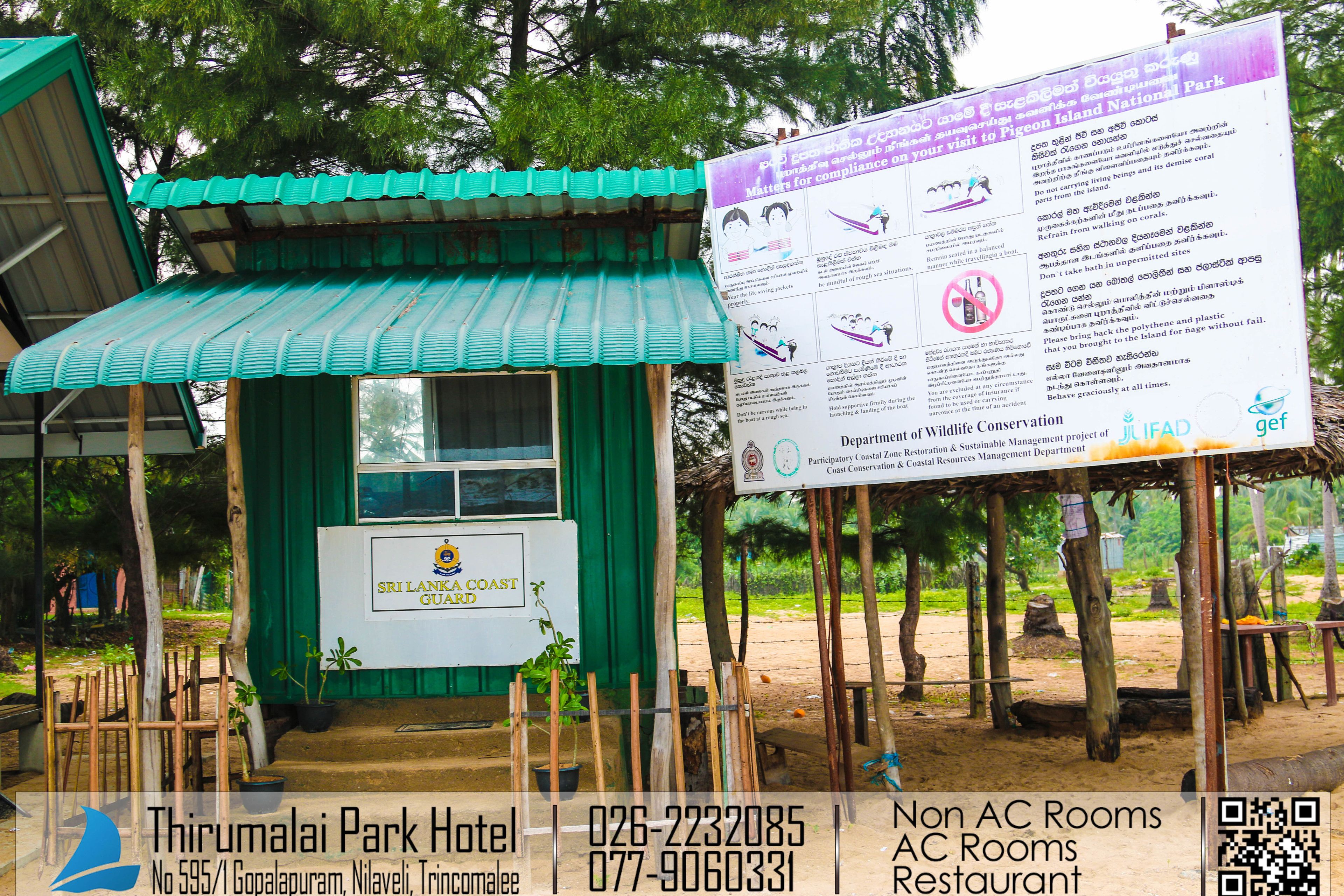 A small structure with a green roof and a signboard for Sri Lanka Coast Guard.