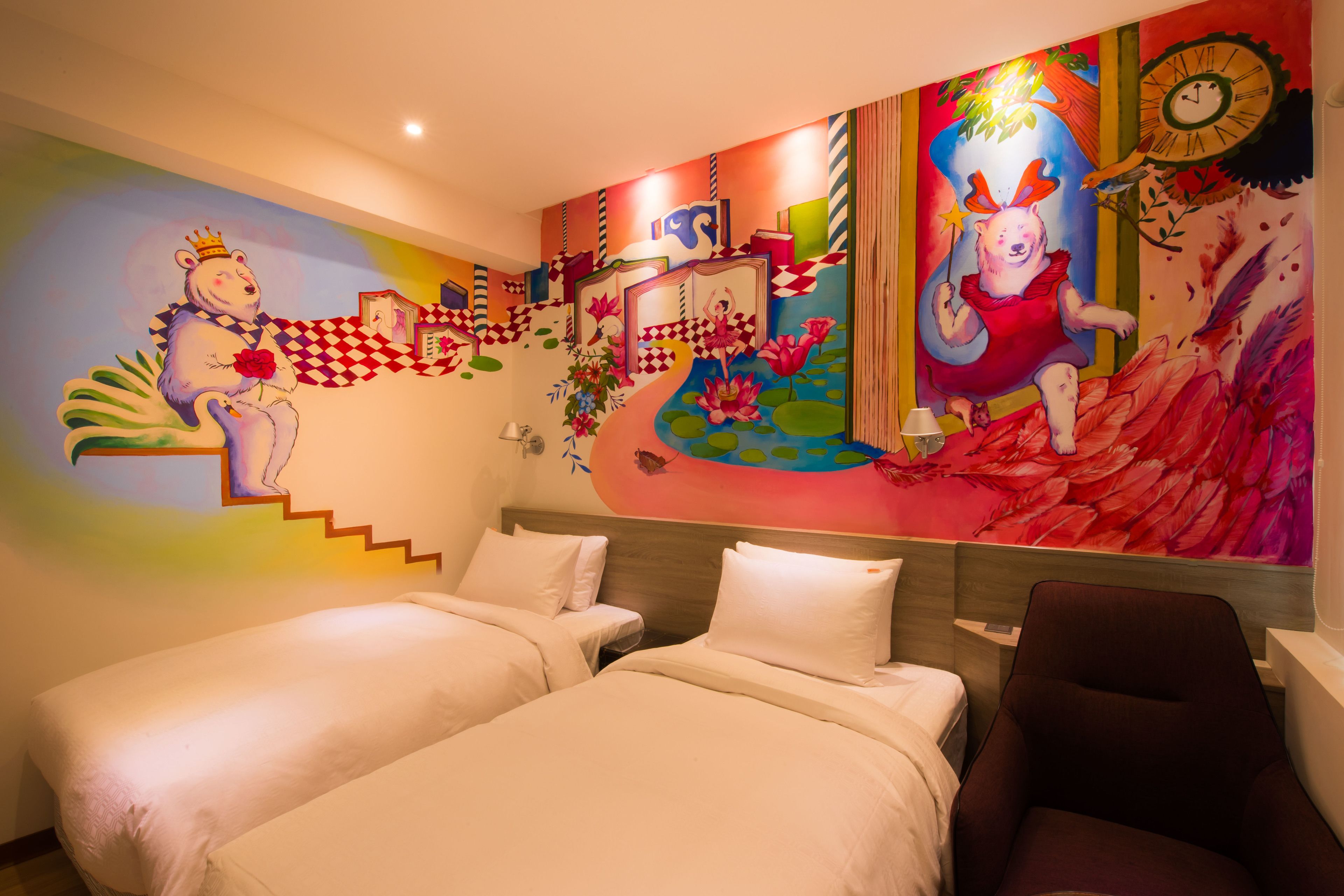A hotel room with two beds, a large colorful mural on the wall, and a clock.