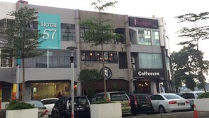 A hotel with a sign reading "HOTEL 57" and a coffee shop named "Coffeezzoo" on the ground floor. - Hotel 57 Subang Jaya (Subang Jaya)