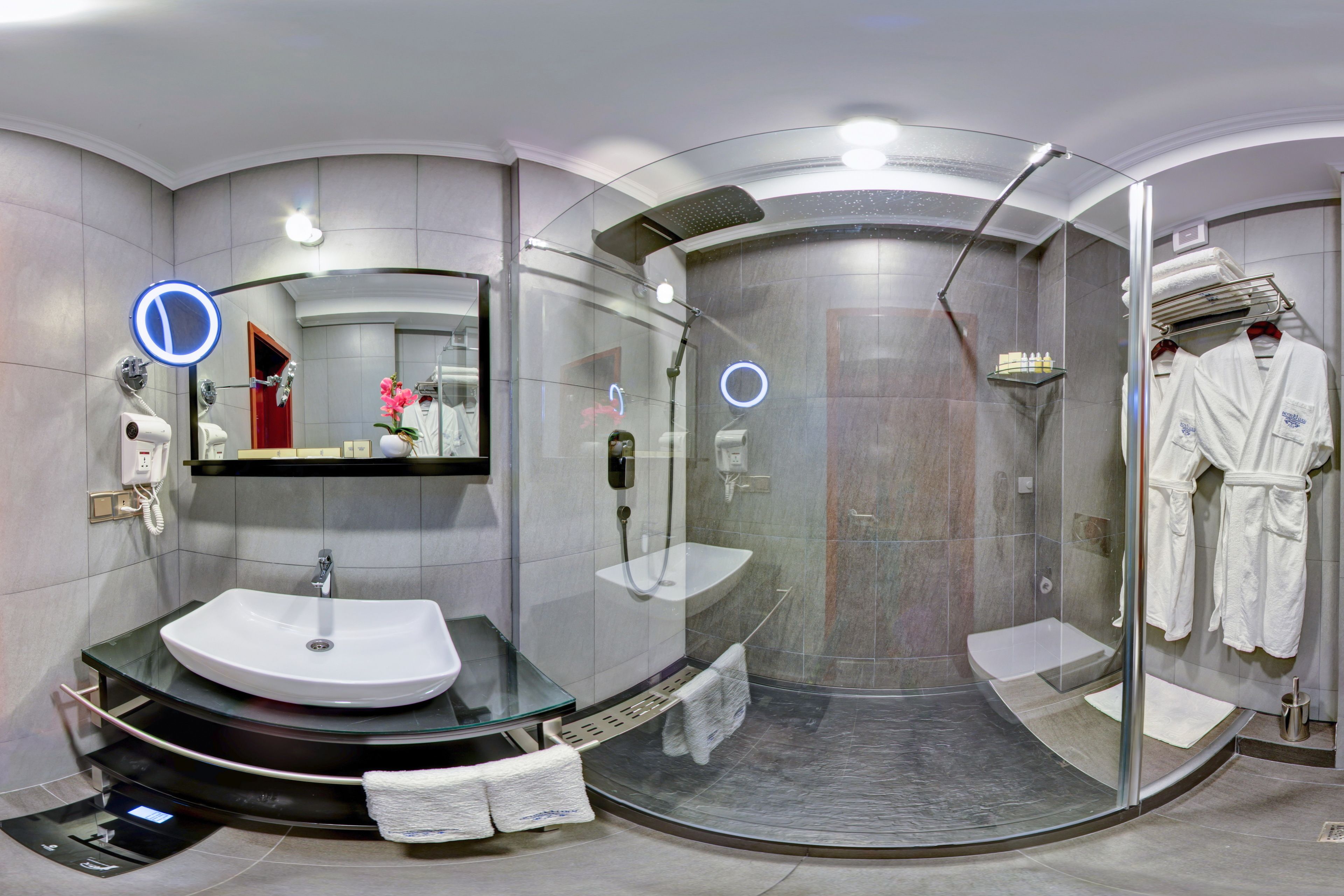 twin room, city view | bathroom | shower, rainfall showerhead, hair dryer, bathrobes