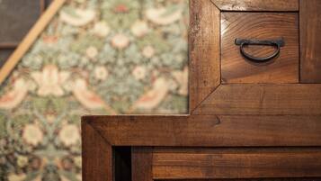 A wooden cabinet with a metal handle.