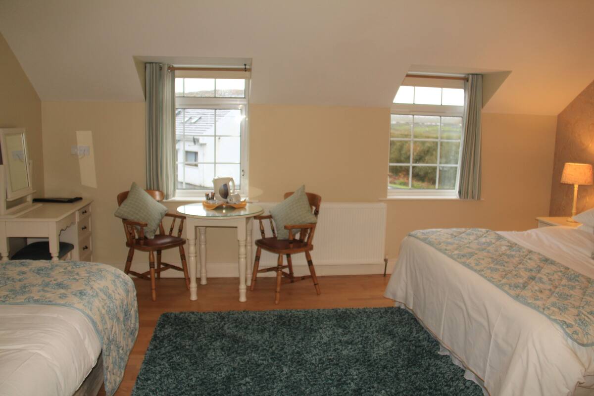 family room | premium bedding, in-room safe, iron/ironing board, free cots/infant beds