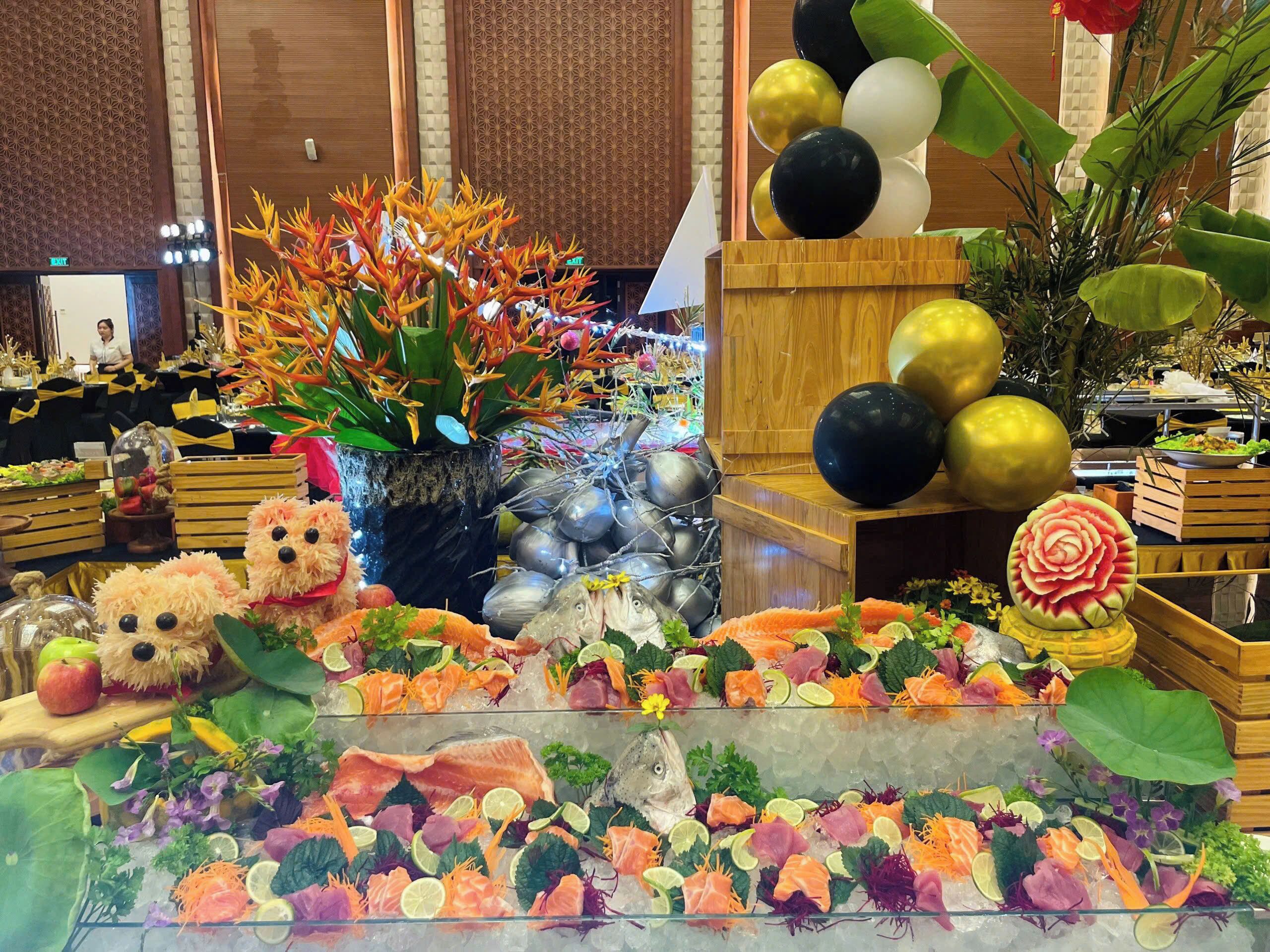 A seafood display with ice, surrounded by decorative plants and a teddy bear.