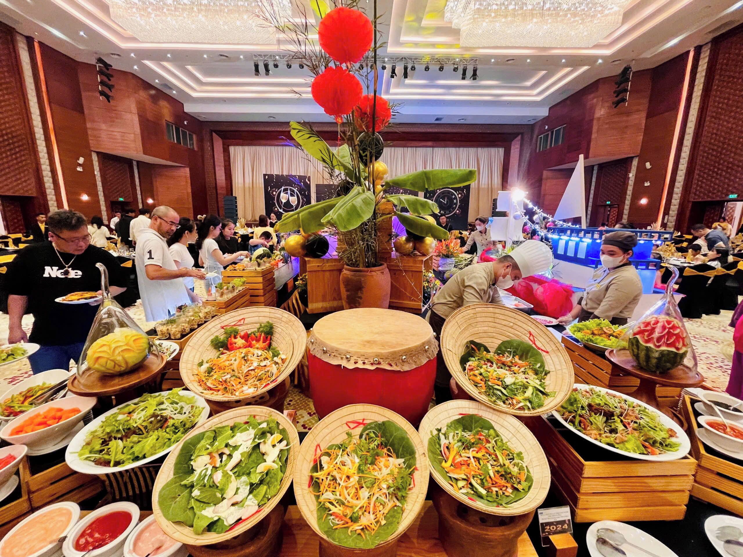 A buffet setup with various dishes and a decorative centerpiece.