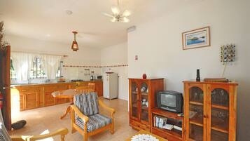 Apartment, 1 Bedroom | Living area | 39-inch LCD TV with cable channels, TV
