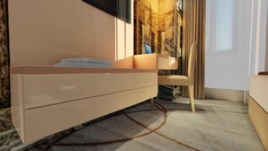 A modern bedroom with a minimalist design, featuring a large bed, a bedside table with a flat-screen TV, and a chair. - Hotel Old Town (Sarajevo)