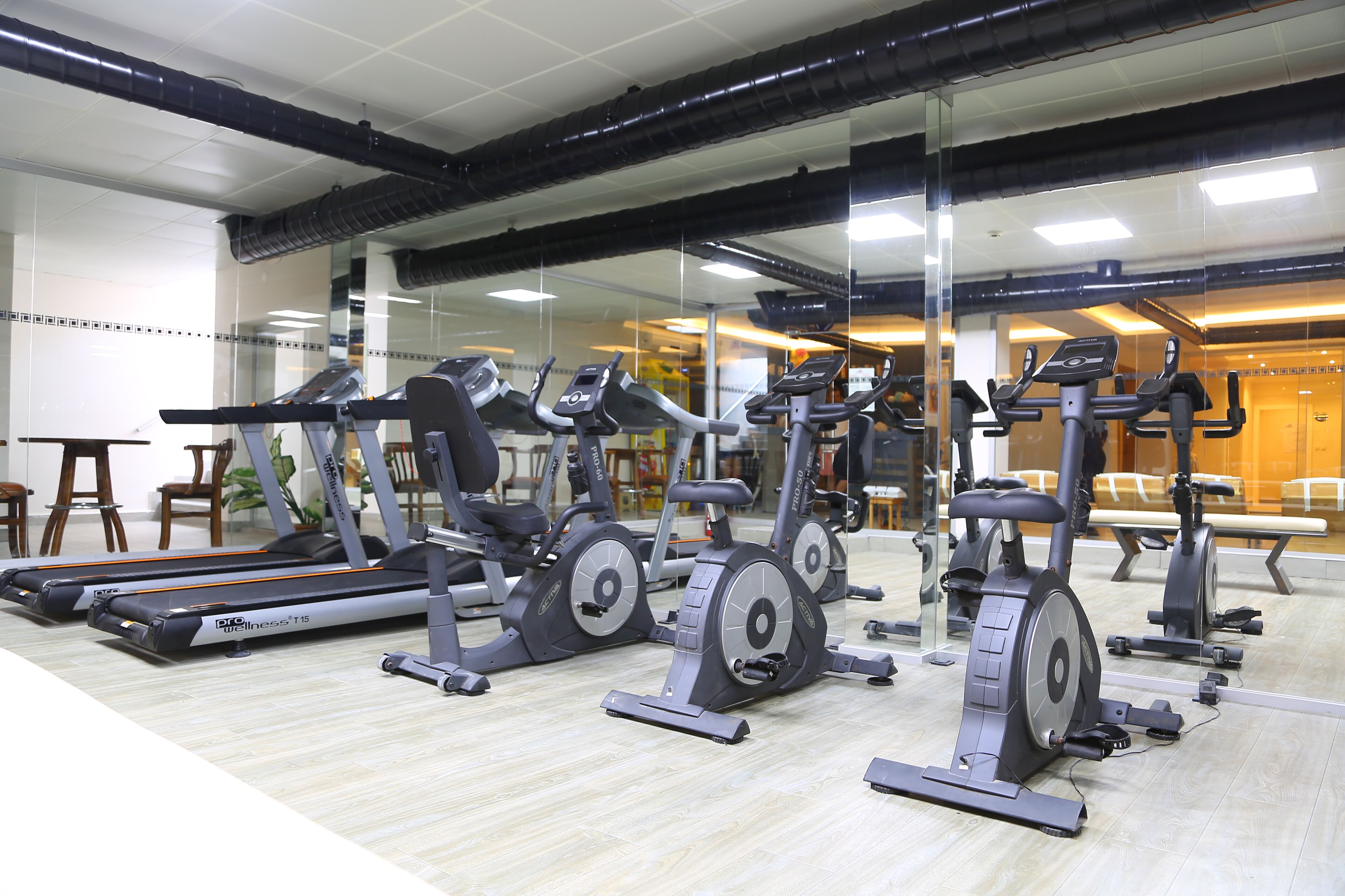 A gym with stationary bikes and treadmills.