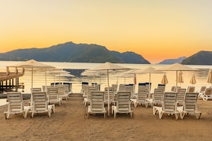 Private beach, beach umbrellas, beach towels