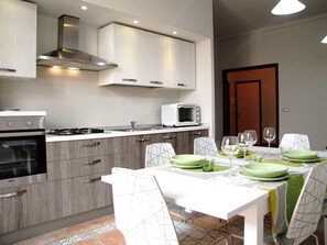 Apartment, 3 Bedrooms | Private kitchen | Full-size fridge, microwave, oven, stovetop