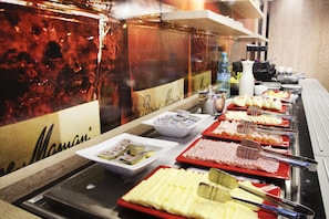 Daily buffet breakfast (USD 39 per person)